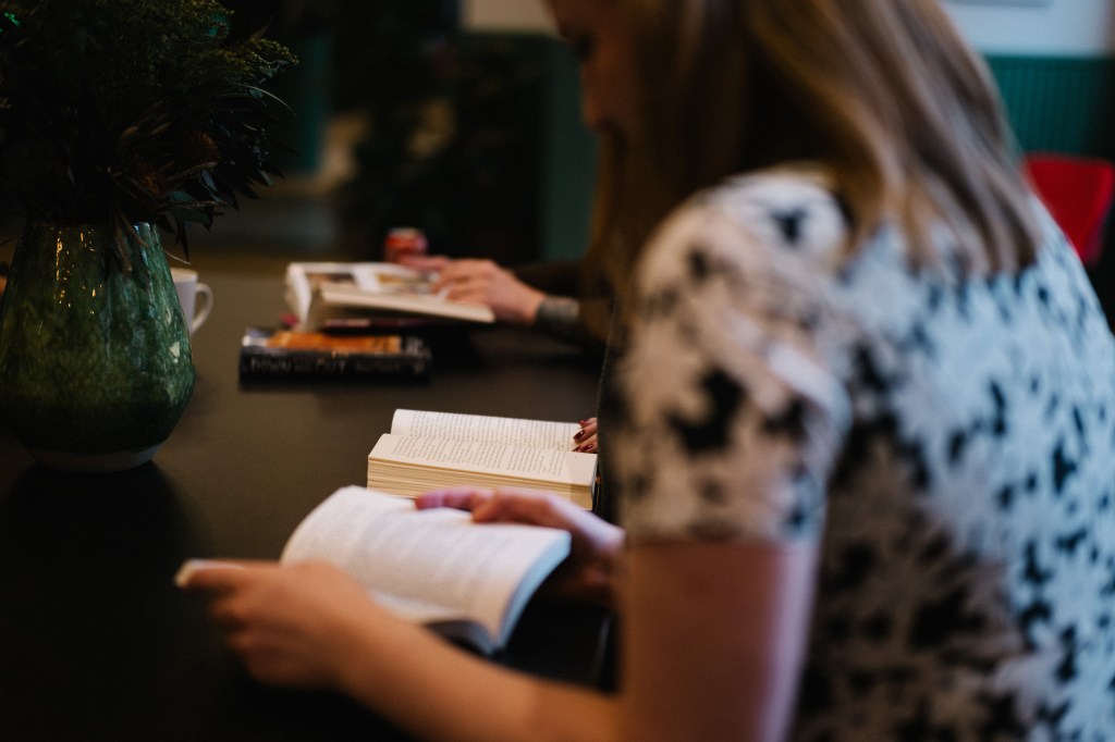 Person reading a book.