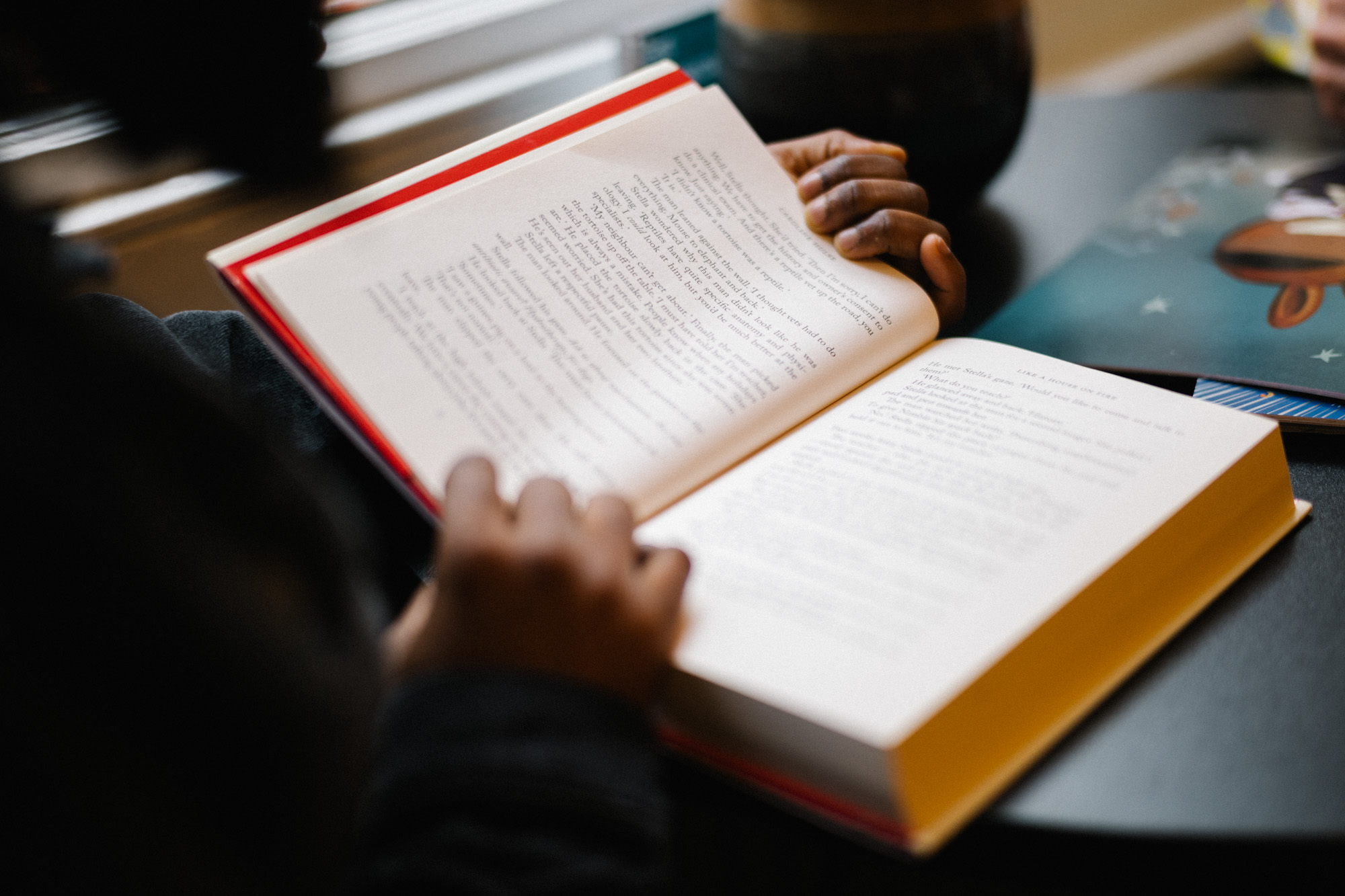 Person reading a book.